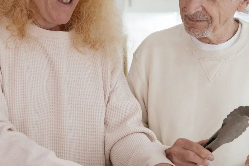Older couple preparing a meal together